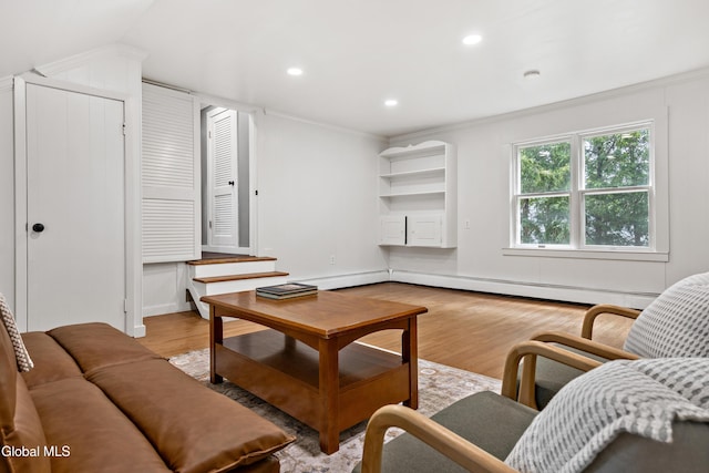 84 Glenwood Ave, Queensbury, NY 12804 - living area featuring wood finished floors, ornamental molding, recessed lighting, and a baseboard heating unit