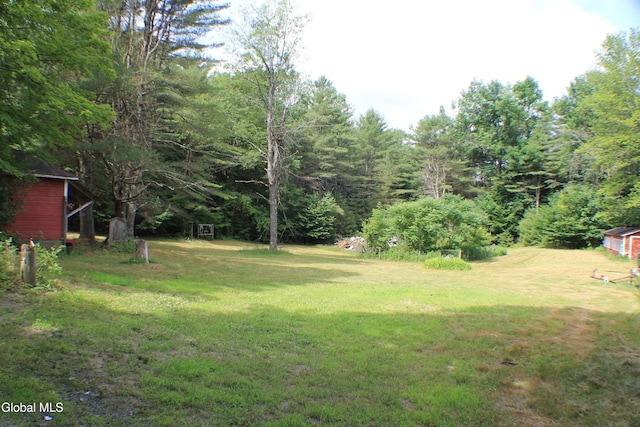 135 Glenwild Rd, Providence, NY 12850 - view of grassy yard featuring a wooded view