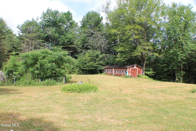 135 Glenwild Rd, Providence, NY 12850 - view of green lawn with an outdoor structure and a wooded view