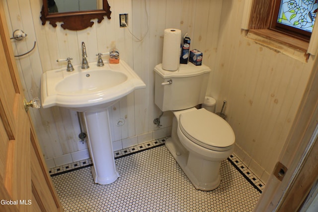 135 Glenwild Rd, Providence, NY 12850 - half bath with wooden walls and tile patterned flooring
