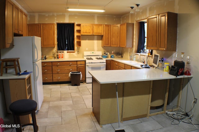 135 Glenwild Rd, Providence, NY 12850 - kitchen with white appliances, a peninsula, light countertops, open shelves, and brown cabinets