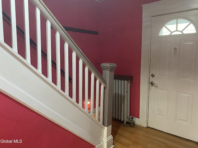 1341 7th Ave, Schenectady, NY 12303 - entryway featuring wood finished floors, stairway, and radiator