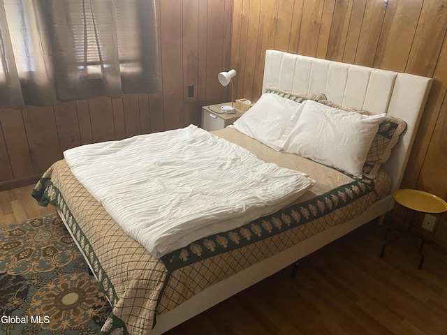 1341 7th Ave, Schenectady, NY 12303 - bedroom featuring wood finished floors and wooden walls