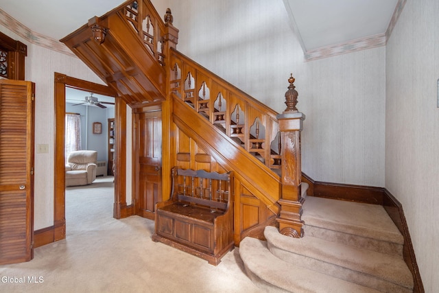 138 Elm St, Cobleskill, NY 12043 - staircase with carpet flooring, wallpapered walls, ornamental molding, and a ceiling fan