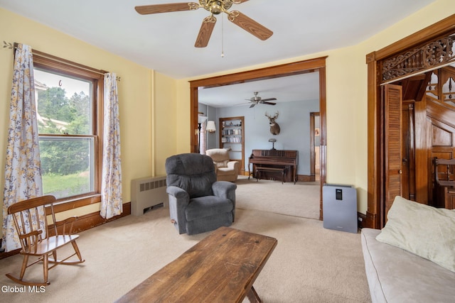 138 Elm St, Cobleskill, NY 12043 - carpeted living area with radiator heating unit and a ceiling fan