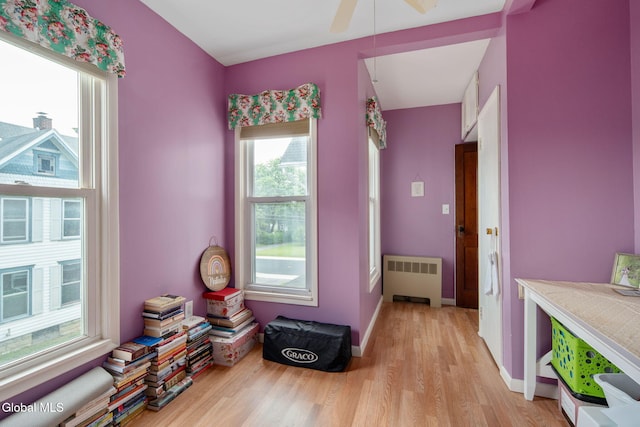 138 Elm St, Cobleskill, NY 12043 - misc room with radiator, light wood finished floors, and ceiling fan