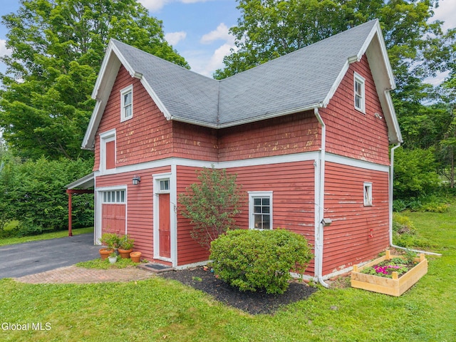 138 Elm St, Cobleskill, NY 12043 - view of property exterior with driveway, a garage, a yard, and a shingled roof