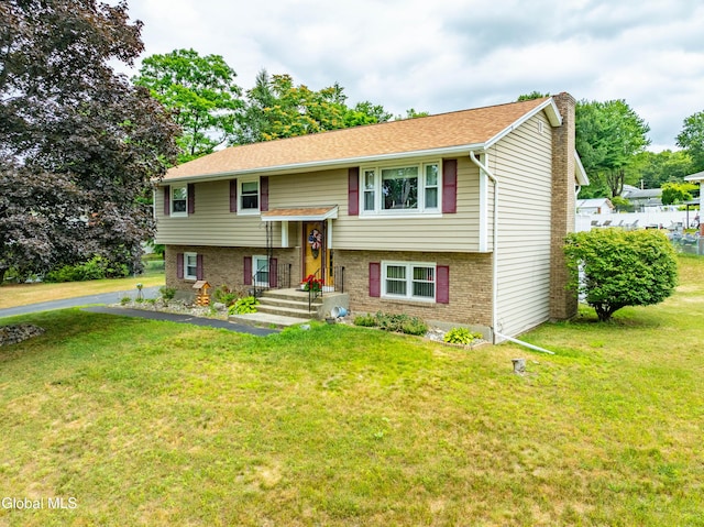 10 Tower Hts, Colonie, NY 12211 - raised ranch featuring a chimney, a front yard, and brick siding