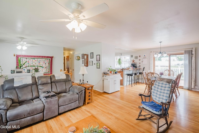 10 Tower Hts, Colonie, NY 12211 - living area featuring ceiling fan, light wood finished floors, and a chandelier