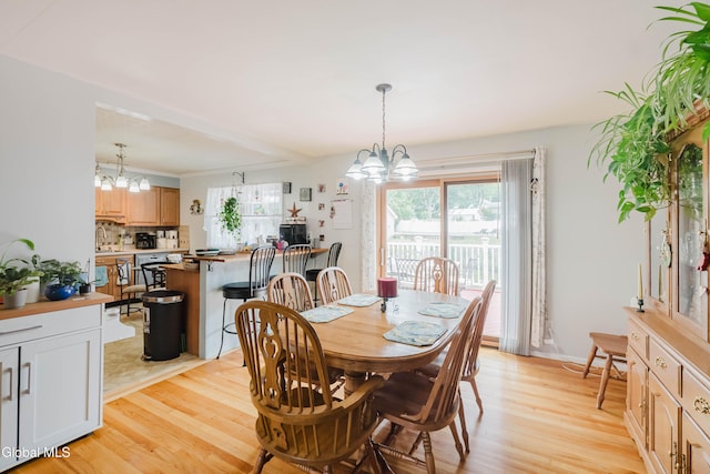 10 Tower Hts, Colonie, NY 12211 - dining area featuring a chandelier and light wood-type flooring