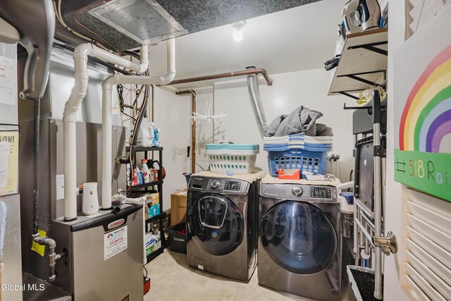 10 Tower Hts, Colonie, NY 12211 - washroom with separate washer and dryer, heating unit, and tile patterned floors