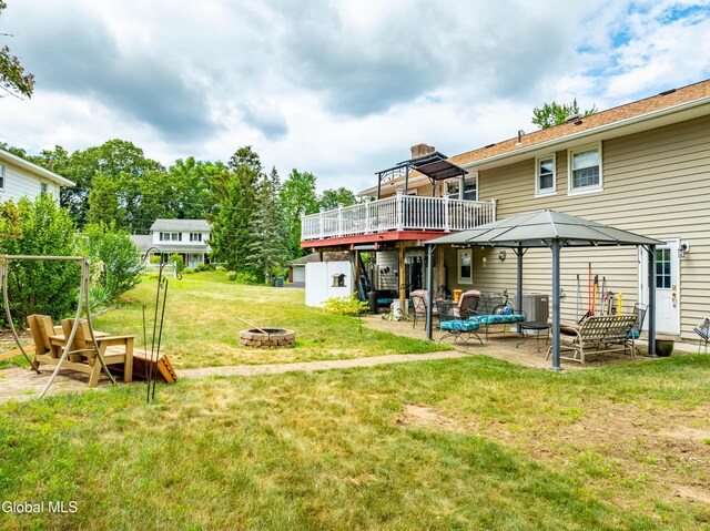 10 Tower Hts, Colonie, NY 12211 - view of grassy yard featuring an outdoor fire pit, a patio, a deck, and a gazebo