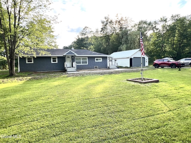 12 Louden Rd, Saratoga Springs, NY 12866 - view of front facade with entry steps, a front yard, an outdoor structure, and a garage