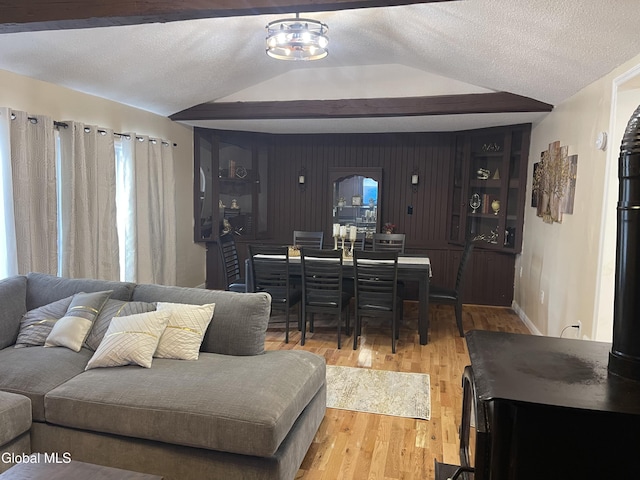 12 Louden Rd, Saratoga Springs, NY 12866 - living area featuring lofted ceiling, wood finished floors, and plenty of natural light