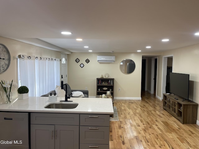 12 Louden Rd, Saratoga Springs, NY 12866 - kitchen featuring stainless steel dishwasher, gray cabinets, light wood-style floors, a wall mounted AC, and recessed lighting