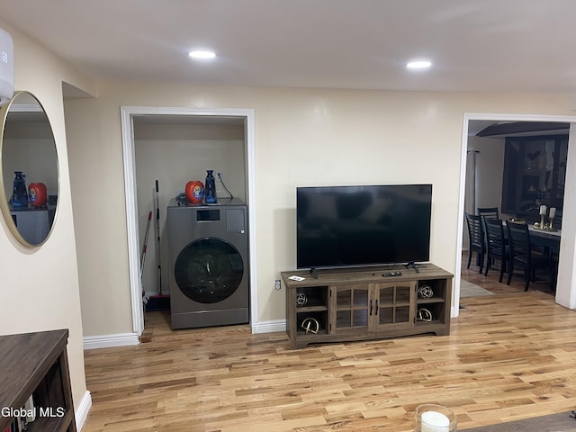 12 Louden Rd, Saratoga Springs, NY 12866 - living room with wood finished floors, washer / dryer, and recessed lighting