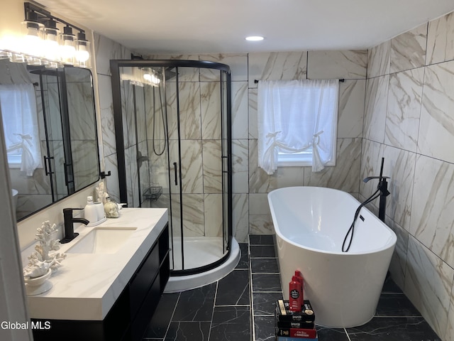 12 Louden Rd, Saratoga Springs, NY 12866 - bathroom featuring marble finish floors, vanity, a soaking tub, a shower stall, and recessed lighting