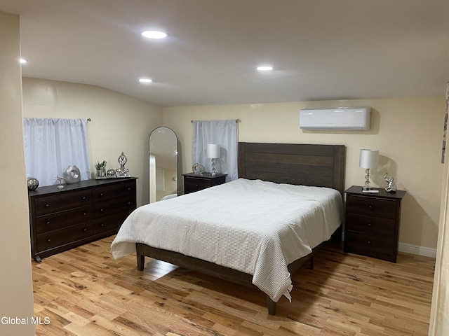 12 Louden Rd, Saratoga Springs, NY 12866 - bedroom featuring a wall mounted AC, light wood-style flooring, and recessed lighting
