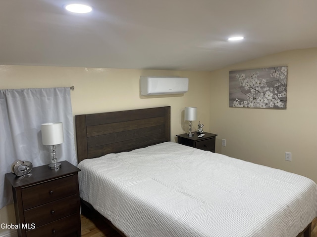 12 Louden Rd, Saratoga Springs, NY 12866 - bedroom with a wall unit AC, recessed lighting, and dark wood-style flooring