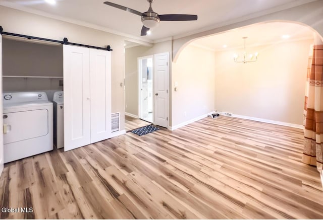 4 Hillside Ave, Schenectady, NY 12308 - washroom featuring arched walkways, ceiling fan, washer and dryer, a barn door, and ornamental molding
