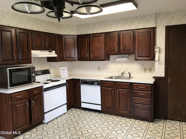 23 Cottage Hill Rd, Queensbury, NY 12804 - kitchen featuring white appliances, under cabinet range hood, light countertops, wallpapered walls, and dark brown cabinets