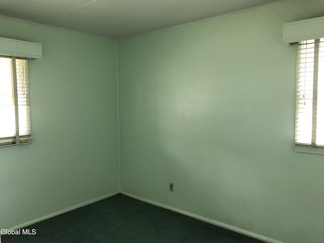 23 Cottage Hill Rd, Queensbury, NY 12804 - spare room with plenty of natural light, dark carpet, and crown molding
