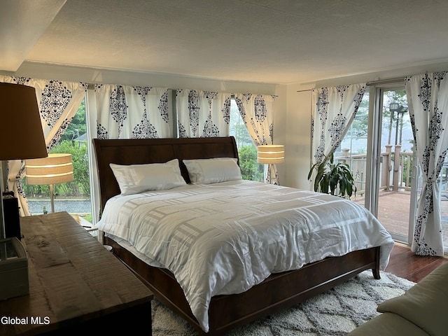 115 Shore Dr, Broadalbin, NY 12025 - bedroom featuring access to exterior and wood finished floors