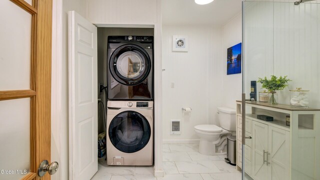 115 Shore Dr, Broadalbin, NY 12025 - laundry room with stacked washing machine and dryer and light marble finish floors