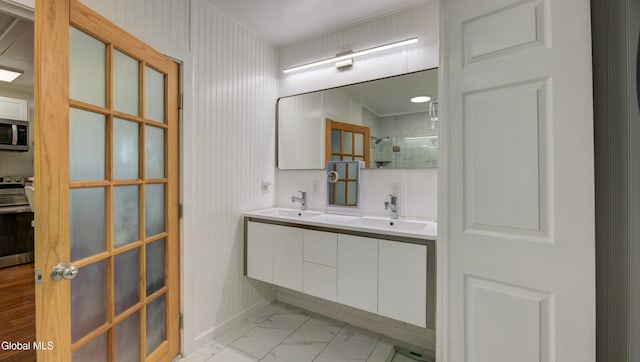 115 Shore Dr, Broadalbin, NY 12025 - bathroom with a tile shower, double vanity, and marble look tiles
