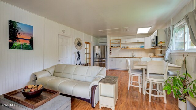 115 Shore Dr, Broadalbin, NY 12025 - living area featuring attic access and light wood-style flooring