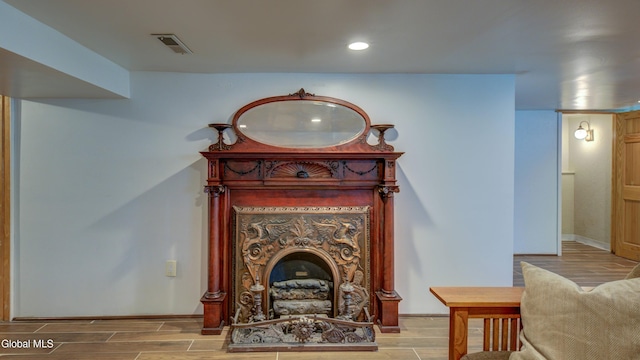 115 Shore Dr, Broadalbin, NY 12025 - detailed view of wood finish floors, recessed lighting, and a fireplace with raised hearth