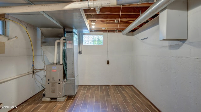 115 Shore Dr, Broadalbin, NY 12025 - below grade area featuring wood finished floors and heating unit