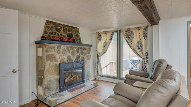 115 Shore Dr, Broadalbin, NY 12025 - living area with wood finished floors, a fireplace, and ornamental molding