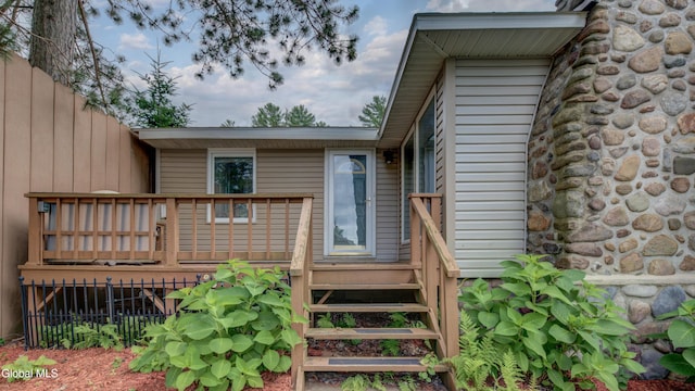 115 Shore Dr, Broadalbin, NY 12025 - property entrance with a deck
