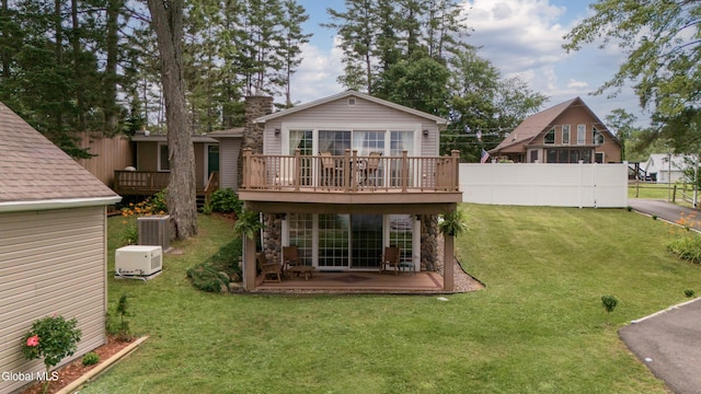 115 Shore Dr, Broadalbin, NY 12025 - back of property with a wooden deck, a chimney, and stone siding