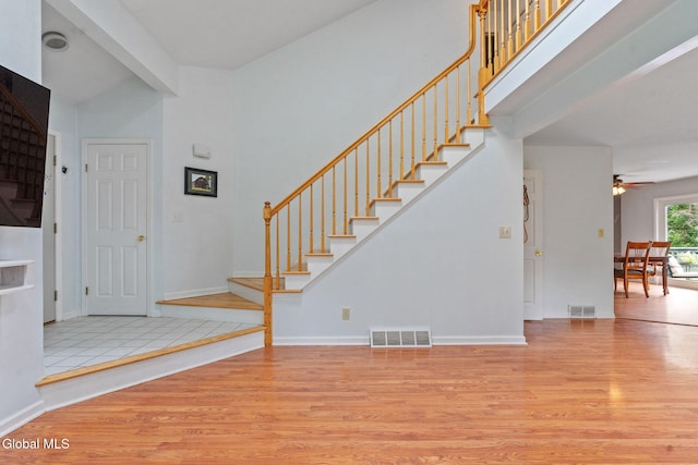 5 Gregg Rd, Altamont, NY 12009 - foyer featuring stairway, wood finished floors, ceiling fan, and a high ceiling