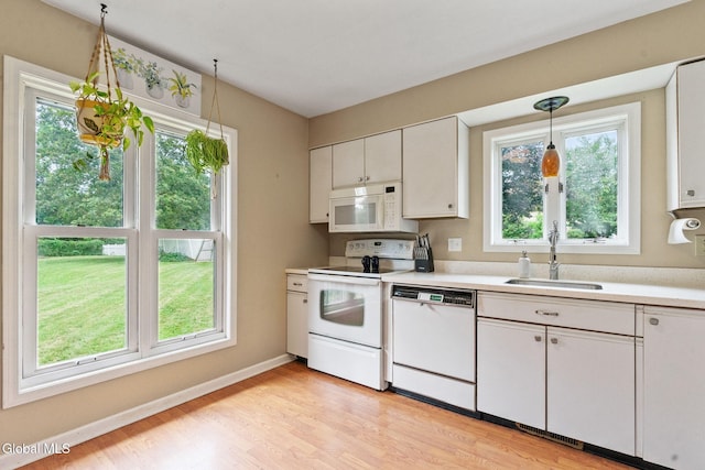 5 Gregg Rd, Altamont, NY 12009 - kitchen with white appliances, plenty of natural light, light countertops, and light wood-style flooring