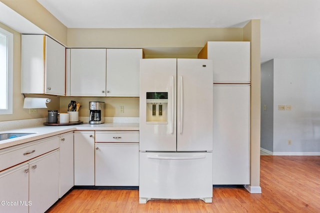 5 Gregg Rd, Altamont, NY 12009 - kitchen featuring white refrigerator with ice dispenser, light countertops, white cabinetry, and light wood-type flooring