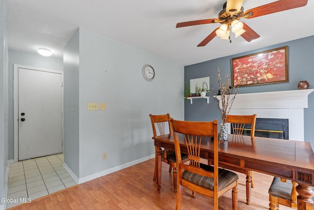 5 Gregg Rd, Altamont, NY 12009 - dining area featuring ceiling fan, light wood-style flooring, and a fireplace