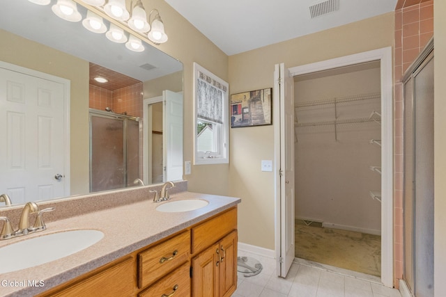 5 Gregg Rd, Altamont, NY 12009 - bathroom with a shower stall, a walk in closet, tile patterned flooring, and double vanity