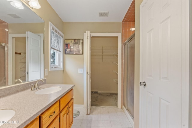 5 Gregg Rd, Altamont, NY 12009 - full bathroom featuring a shower stall, double vanity, tile patterned flooring, and a walk in closet