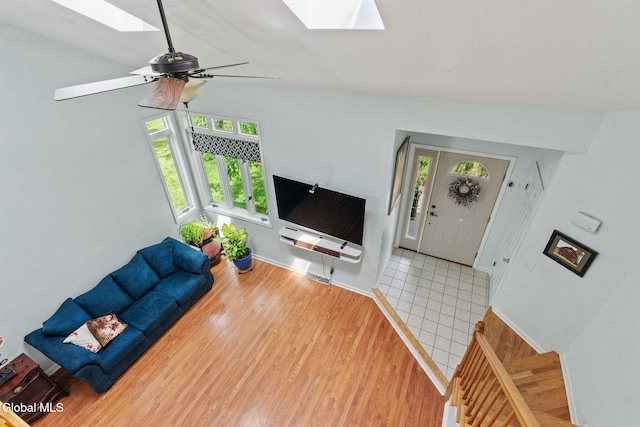 5 Gregg Rd, Altamont, NY 12009 - unfurnished living room featuring a skylight, wood finished floors, and ceiling fan