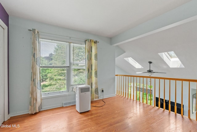 5 Gregg Rd, Altamont, NY 12009 - additional living space with a skylight, wood finished floors, a ceiling fan, and vaulted ceiling