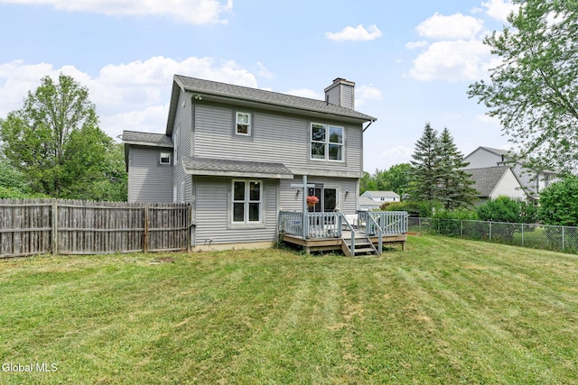 5 Gregg Rd, Altamont, NY 12009 - rear view of property featuring a chimney, a wooden deck, and a fenced backyard