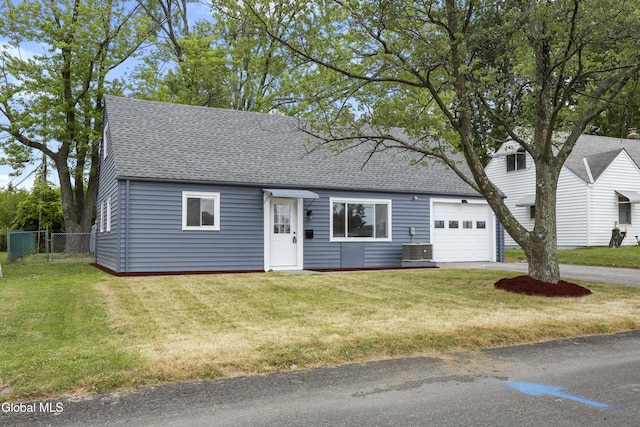 789 Troy Schenectady Rd, Colonie, NY 12110 - cape cod home with a garage, roof with shingles, and driveway