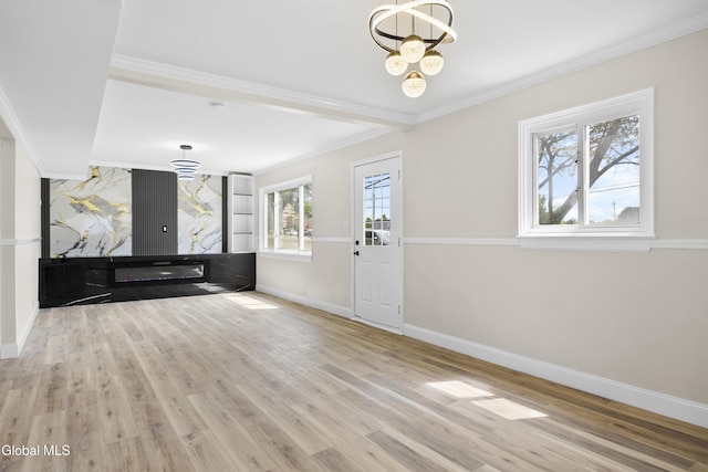 789 Troy Schenectady Rd, Colonie, NY 12110 - foyer entrance featuring ornamental molding, a chandelier, and wood finished floors