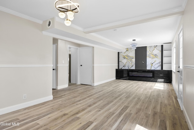 789 Troy Schenectady Rd, Colonie, NY 12110 - unfurnished living room featuring wood finished floors, a chandelier, and ornamental molding