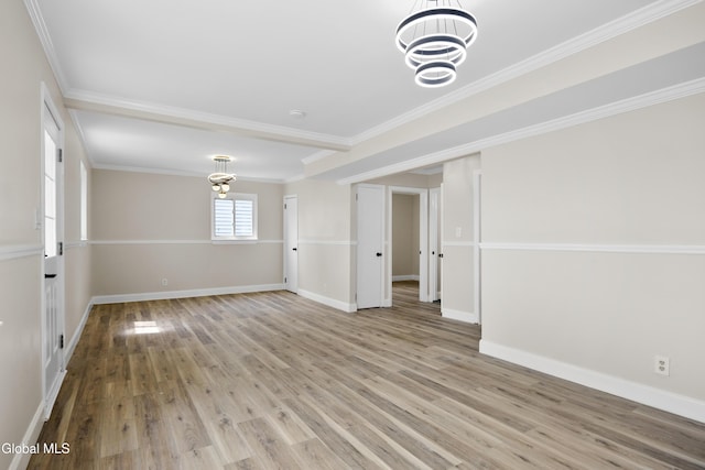 789 Troy Schenectady Rd, Colonie, NY 12110 - empty room with a chandelier, wood finished floors, and ornamental molding
