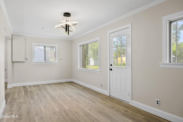 789 Troy Schenectady Rd, Colonie, NY 12110 - interior space with plenty of natural light, a chandelier, light wood-type flooring, and ornamental molding