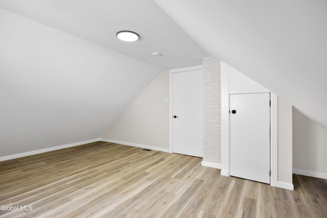 789 Troy Schenectady Rd, Colonie, NY 12110 - additional living space featuring wood finished floors and lofted ceiling